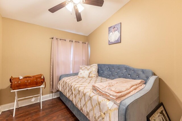 bedroom featuring ceiling fan, vaulted ceiling, and dark hardwood / wood-style floors