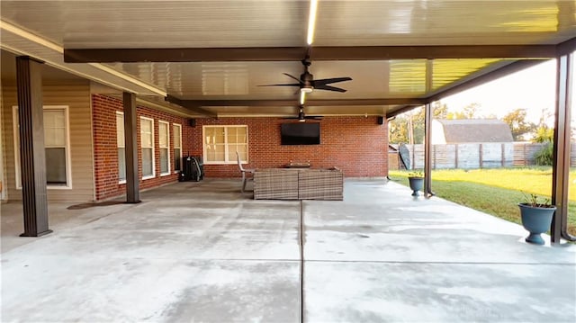 view of patio featuring ceiling fan