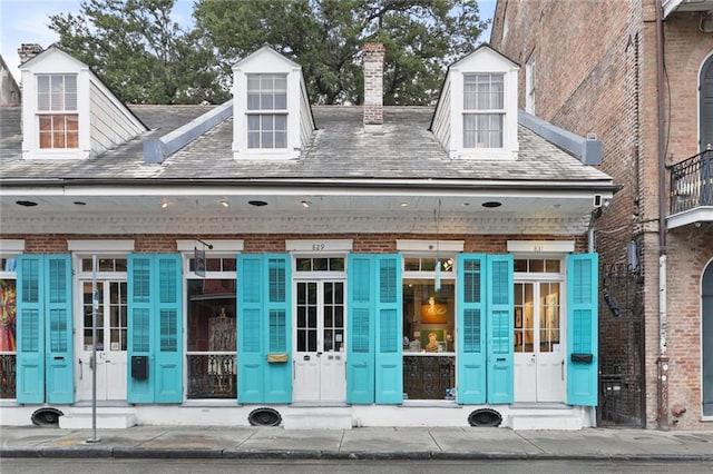 view of exterior entry featuring french doors