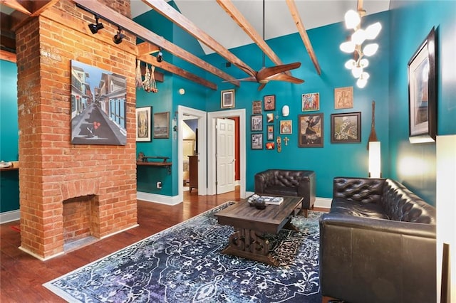 interior space with a chandelier, a fireplace, and dark hardwood / wood-style flooring