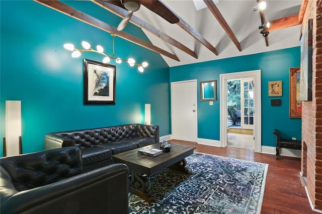 living room with beamed ceiling, dark hardwood / wood-style floors, and ceiling fan