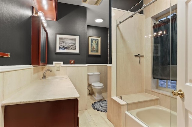 full bathroom with plus walk in shower, tile patterned floors, vanity, and toilet