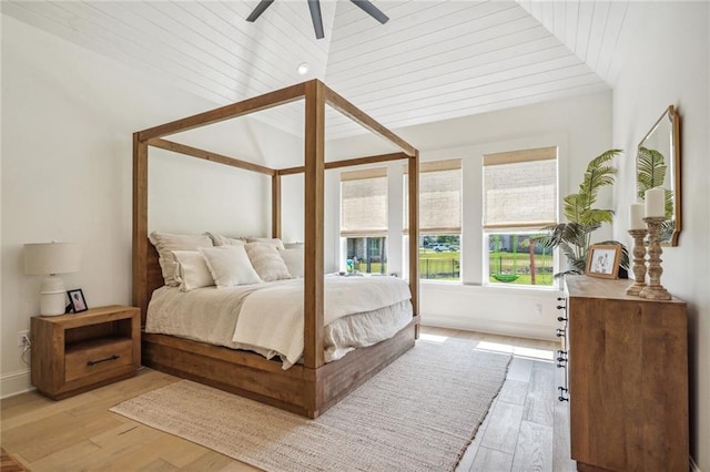 bedroom with high vaulted ceiling, light hardwood / wood-style floors, ceiling fan, and wood ceiling