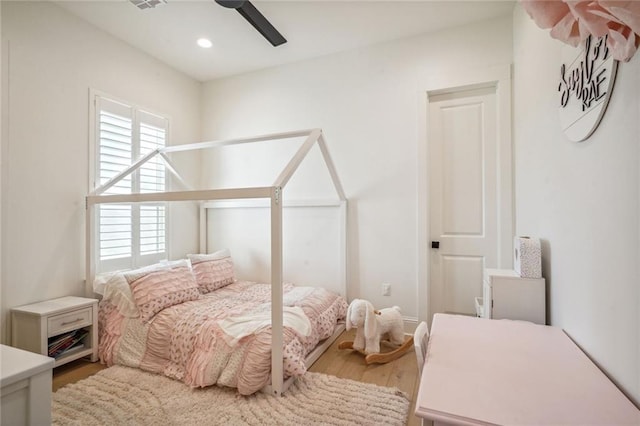 bedroom featuring ceiling fan and wood-type flooring