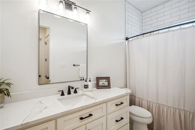 bathroom with walk in shower, vanity, and toilet