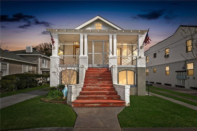 119 Elmeer Ave, Metairie, LA 70005 - view of front facade featuring covered porch, stairs, and a front yard