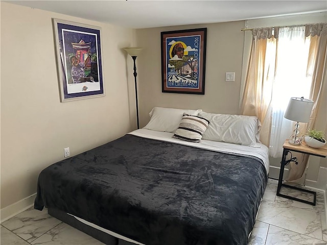 119 Elmeer Ave, Metairie, LA 70005 - bedroom featuring light marble finish flooring and baseboards