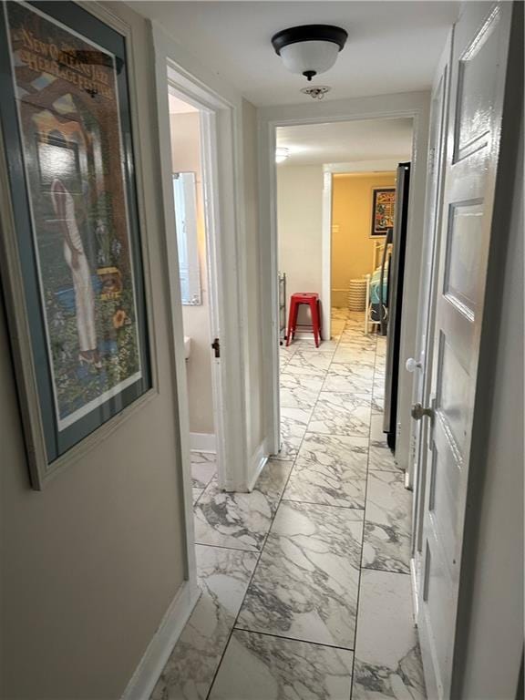 119 Elmeer Ave, Metairie, LA 70005 - hallway with light marble finish flooring and baseboards