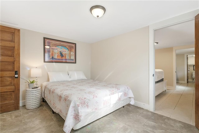 bedroom featuring light tile patterned flooring