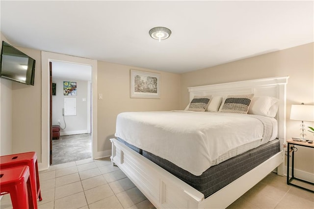 bedroom with light tile patterned floors