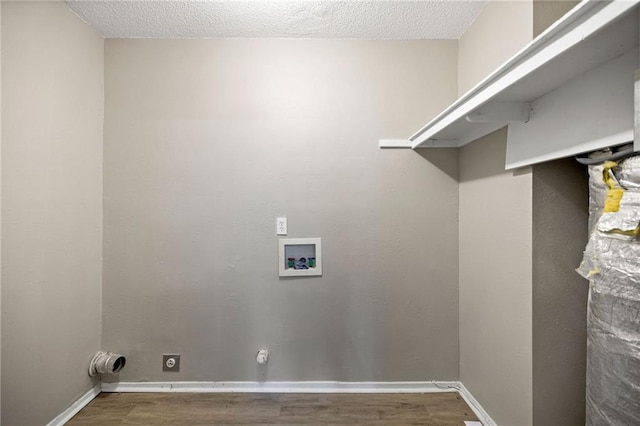 laundry room with a textured ceiling, wood-type flooring, hookup for an electric dryer, and washer hookup