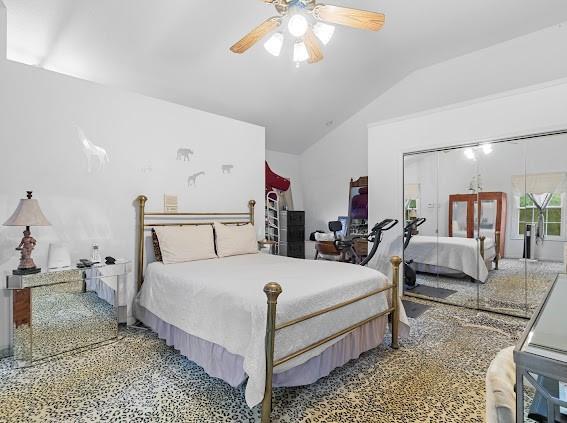 bedroom with vaulted ceiling and ceiling fan