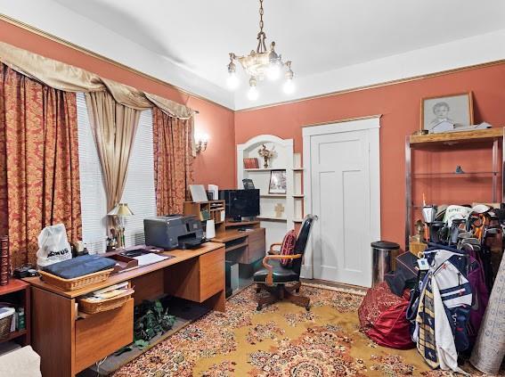 office area featuring a wealth of natural light and a notable chandelier