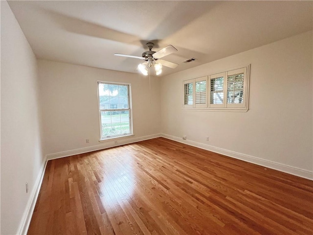 spare room featuring ceiling fan and wood-type flooring