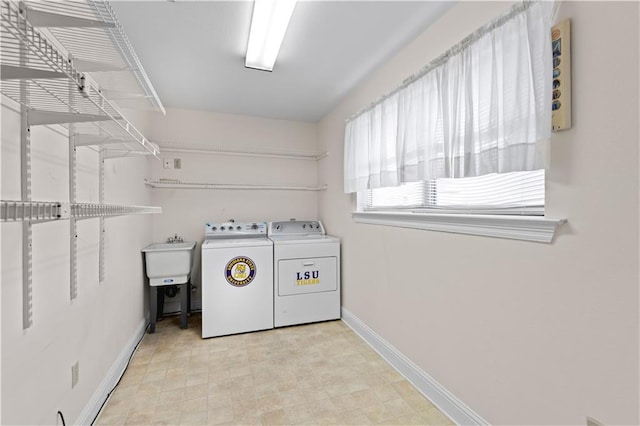 washroom featuring independent washer and dryer