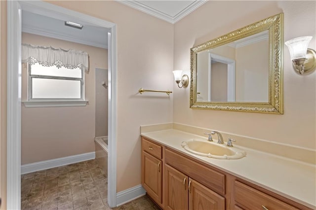 bathroom with ornamental molding and vanity