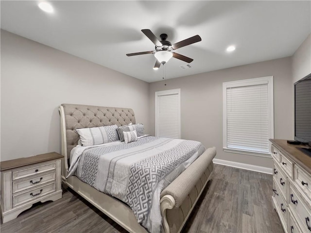 bedroom featuring ceiling fan and dark hardwood / wood-style floors