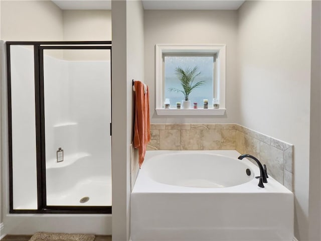 bathroom featuring plus walk in shower