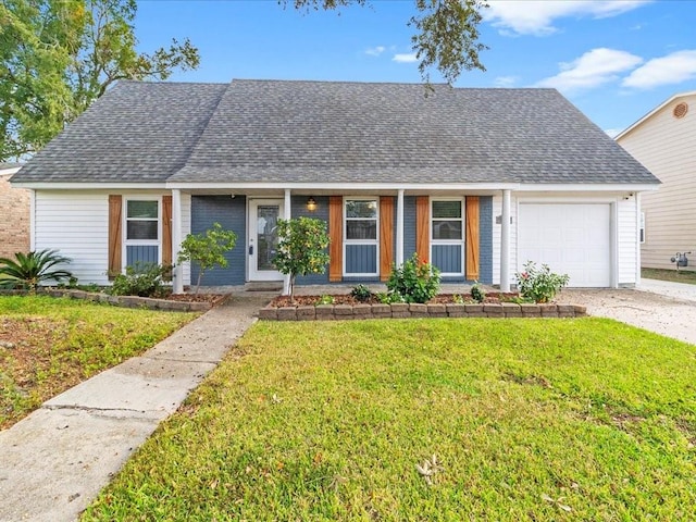 single story home with a front yard and a garage