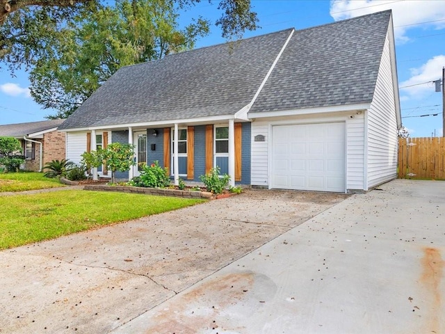 view of front of house with a front lawn and a garage