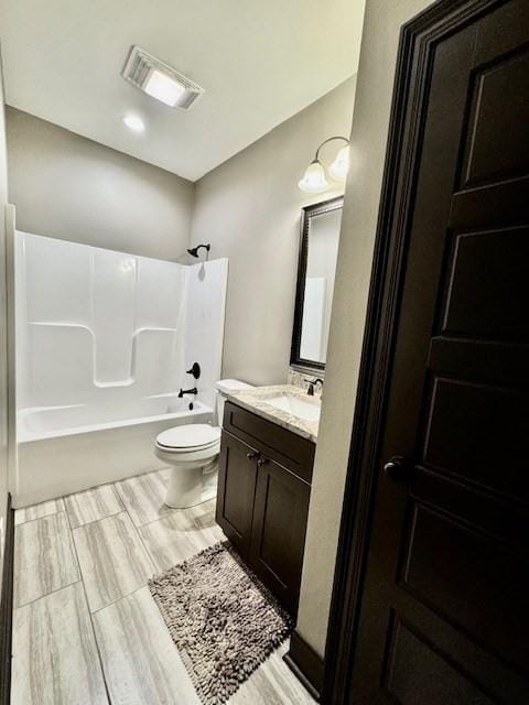 full bathroom featuring shower / tub combination, toilet, and vanity