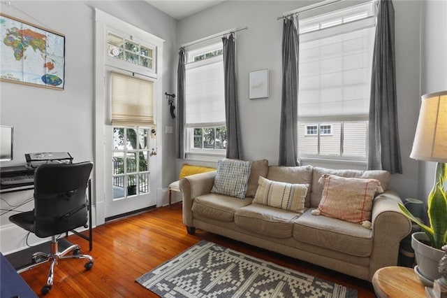 home office with hardwood / wood-style flooring