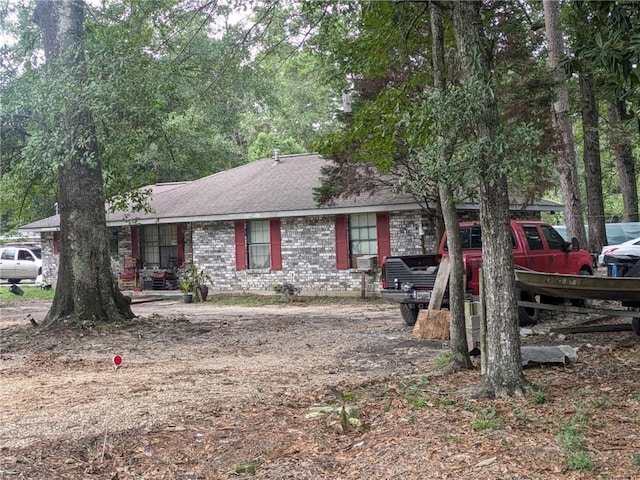 ranch-style home featuring cooling unit