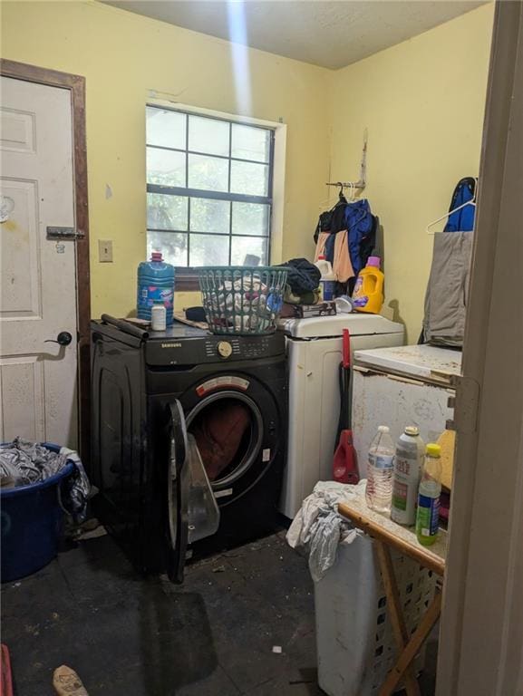 washroom with independent washer and dryer