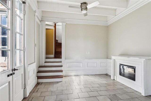 staircase with ceiling fan, ornamental molding, beamed ceiling, and tile patterned flooring