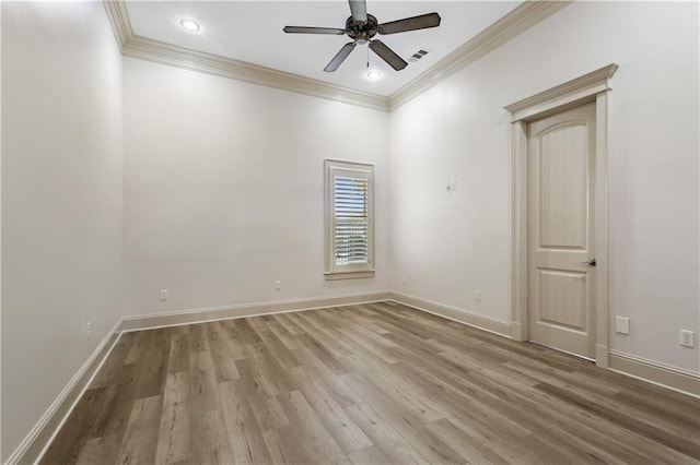 spare room featuring ornamental molding, hardwood / wood-style floors, and ceiling fan