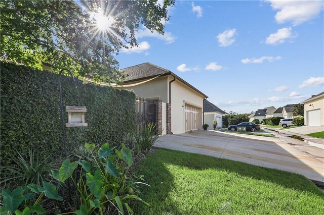 view of side of home with a garage