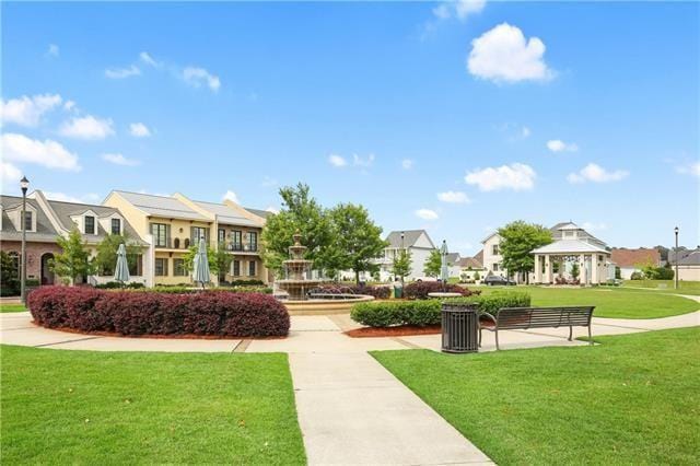 surrounding community featuring a gazebo and a yard