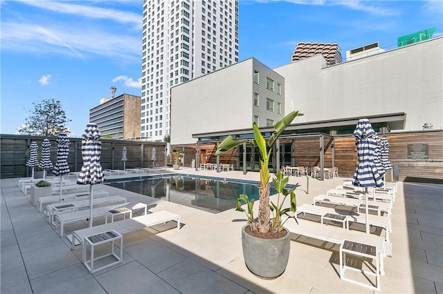 view of swimming pool with a patio