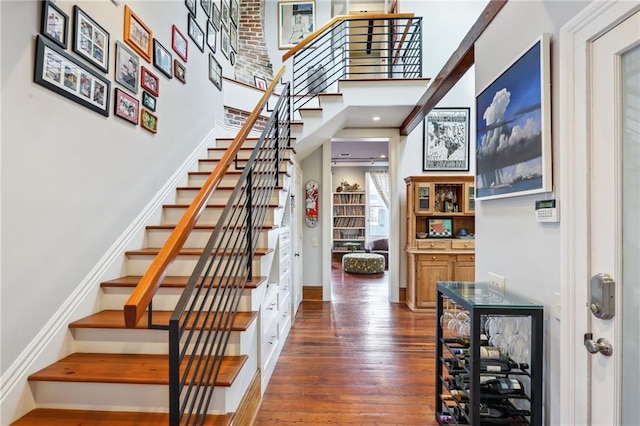 staircase with wood-type flooring