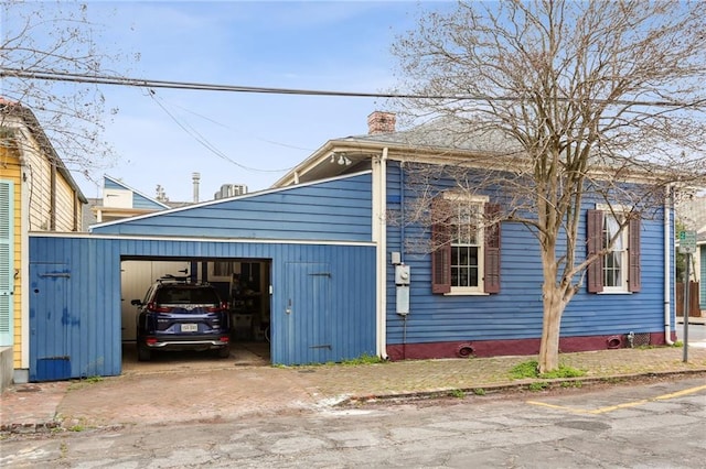 view of property exterior with a garage