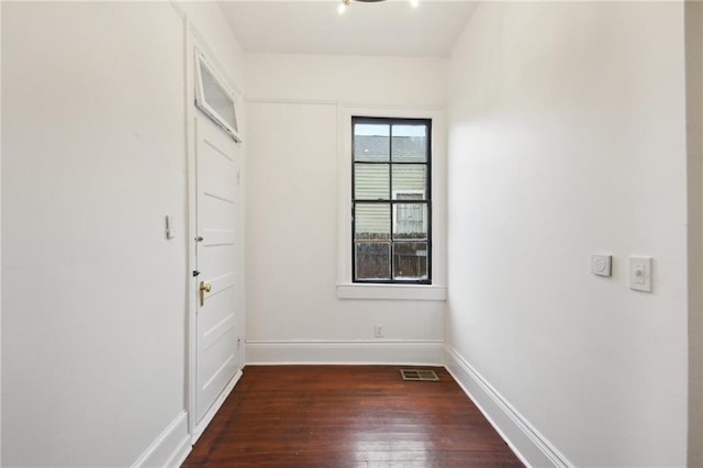 spare room with dark hardwood / wood-style flooring