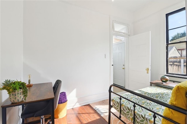 bedroom with hardwood / wood-style floors