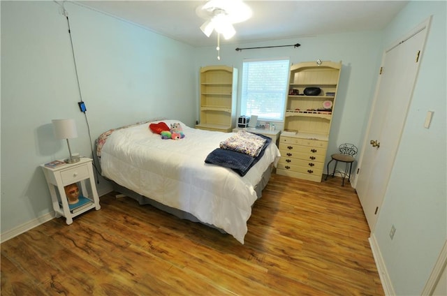 bedroom with wood-type flooring