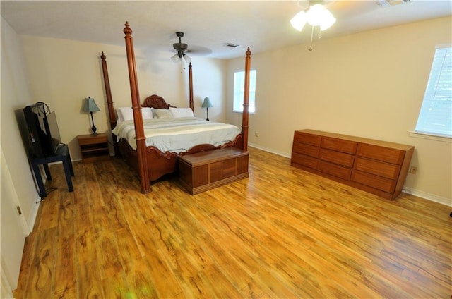 bedroom featuring light hardwood / wood-style floors and ceiling fan