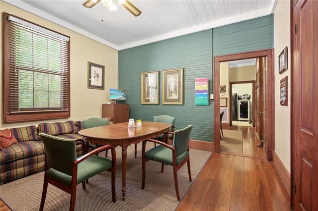 dining room with ceiling fan, hardwood / wood-style flooring, and ornamental molding