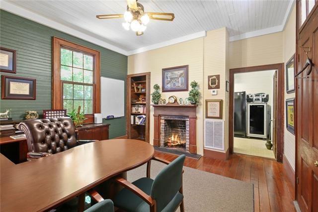 office space featuring crown molding, ceiling fan, and dark hardwood / wood-style floors