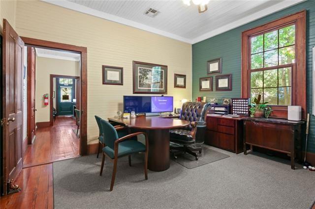 office featuring wood-type flooring and ornamental molding