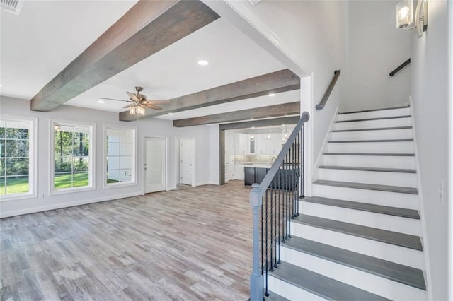 staircase featuring beamed ceiling, visible vents, a ceiling fan, wood finished floors, and recessed lighting