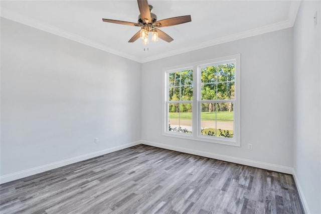 unfurnished room featuring ceiling fan, light wood-type flooring, and ornamental molding