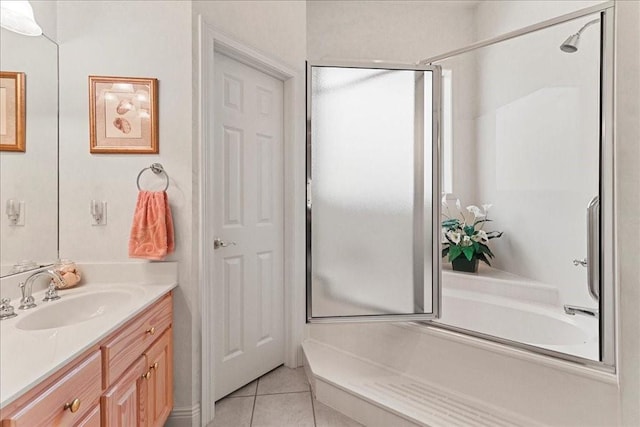 bathroom with independent shower and bath, vanity, and tile patterned floors