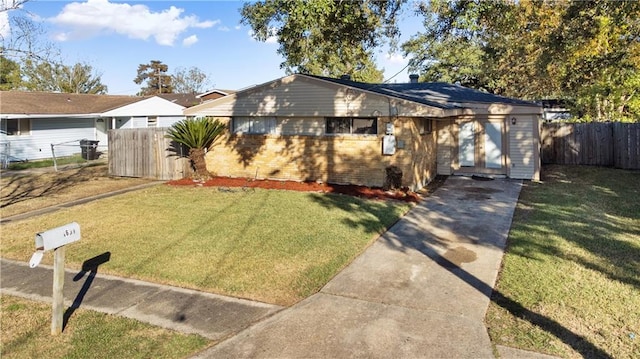 bungalow-style home featuring a front lawn