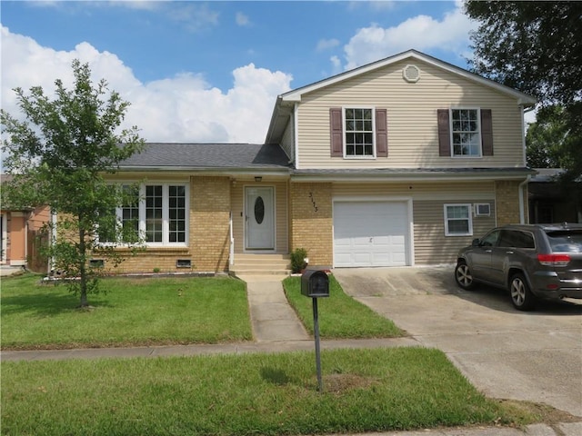 view of front of property with a front yard and a garage