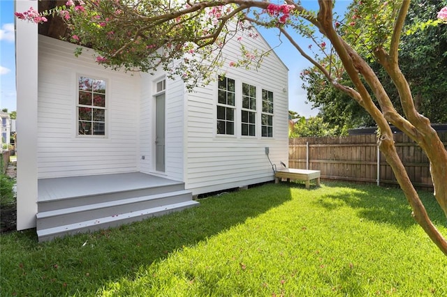 rear view of house with a yard