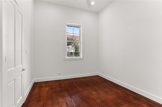 unfurnished room with wood-type flooring