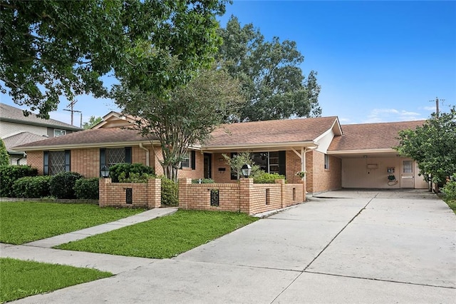 ranch-style home with a carport and a front lawn